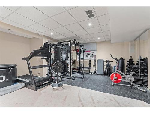 50 Crystalridge Crescent, Okotoks, AB - Indoor Photo Showing Gym Room