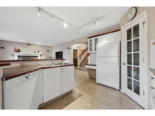 396 Rocky Ridge Drive Nw, Calgary, AB - Indoor Photo Showing Kitchen With Double Sink