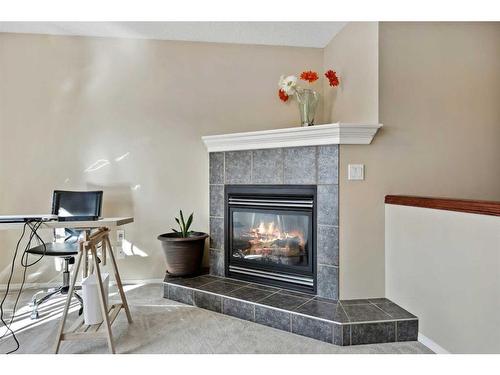 396 Rocky Ridge Drive Nw, Calgary, AB - Indoor With Fireplace