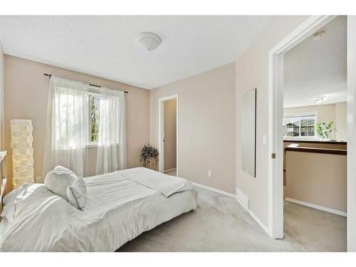 396 Rocky Ridge Drive Nw, Calgary, AB - Indoor Photo Showing Bedroom