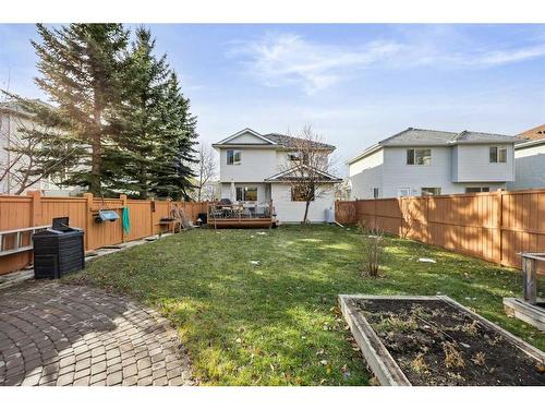 396 Rocky Ridge Drive Nw, Calgary, AB - Outdoor With Deck Patio Veranda With Backyard