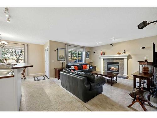 396 Rocky Ridge Drive Nw, Calgary, AB - Indoor Photo Showing Living Room With Fireplace