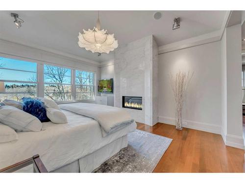 3209 5 Street Nw, Calgary, AB - Indoor Photo Showing Bedroom With Fireplace