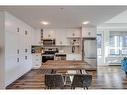 1201-350 Livingston Common Ne, Calgary, AB  - Indoor Photo Showing Kitchen With Stainless Steel Kitchen 