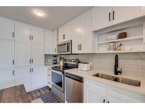 1201-350 Livingston Common Ne, Calgary, AB - Indoor Photo Showing Kitchen With Stainless Steel Kitchen With Double Sink