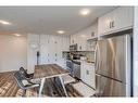 1201-350 Livingston Common Ne, Calgary, AB  - Indoor Photo Showing Kitchen With Stainless Steel Kitchen 