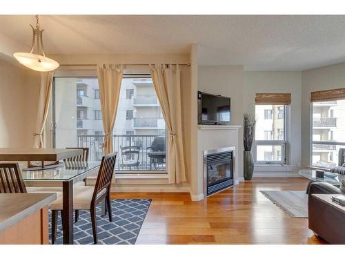 305-108 15 Avenue Se, Calgary, AB - Indoor Photo Showing Living Room With Fireplace