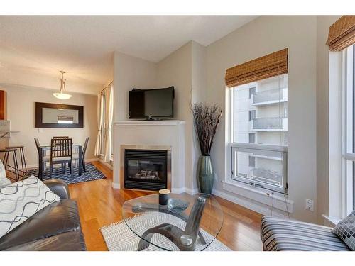 305-108 15 Avenue Se, Calgary, AB - Indoor Photo Showing Living Room With Fireplace