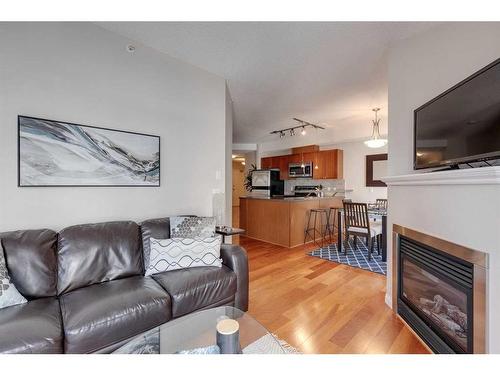 305-108 15 Avenue Se, Calgary, AB - Indoor Photo Showing Living Room With Fireplace