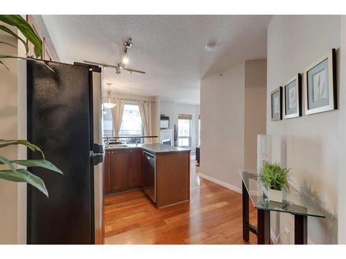 305-108 15 Avenue Se, Calgary, AB - Indoor Photo Showing Kitchen With Double Sink