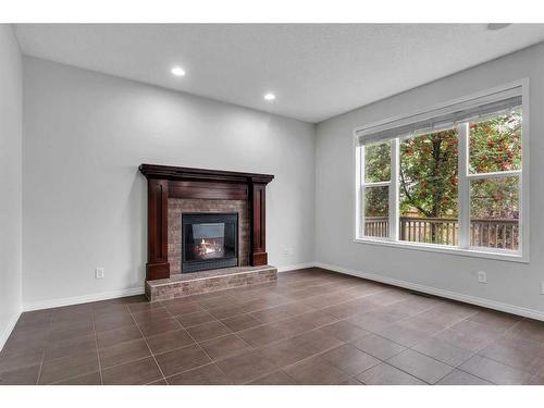 931 Auburn Bay Boulevard Se, Calgary, AB - Indoor Photo Showing Living Room With Fireplace