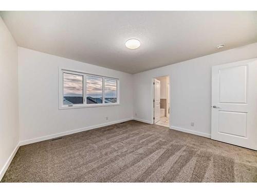 341 Baneberry Way Sw, Airdrie, AB - Indoor Photo Showing Other Room