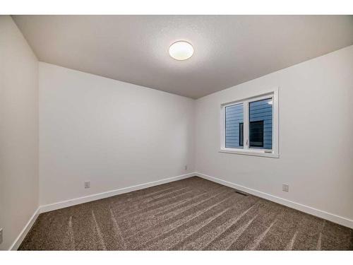 341 Baneberry Way Sw, Airdrie, AB - Indoor Photo Showing Other Room