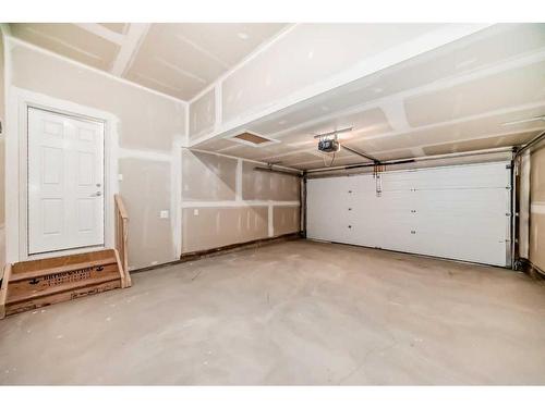 1046 Thimbleberry Hill Sw, Airdrie, AB - Indoor Photo Showing Garage