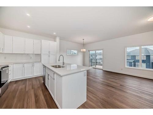 1046 Thimbleberry Hill Sw, Airdrie, AB - Indoor Photo Showing Kitchen With Double Sink With Upgraded Kitchen