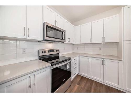 1046 Thimbleberry Hill Sw, Airdrie, AB - Indoor Photo Showing Kitchen