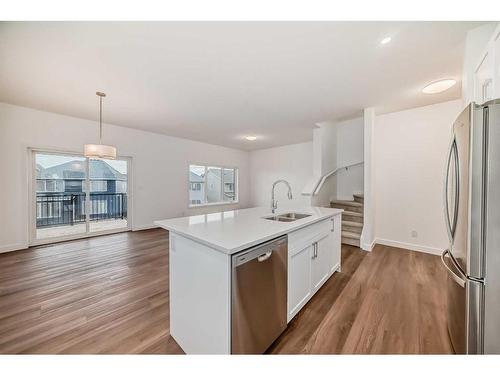 1046 Thimbleberry Hill Sw, Airdrie, AB - Indoor Photo Showing Kitchen With Double Sink With Upgraded Kitchen