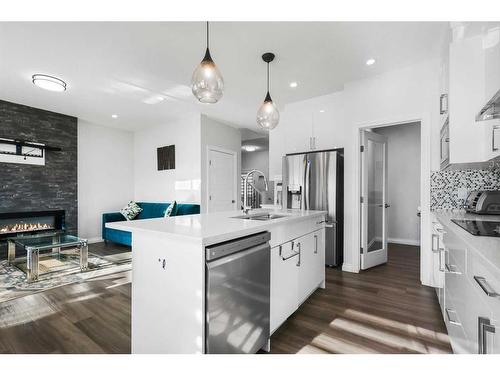 289 Corner Meadows Way Ne, Calgary, AB - Indoor Photo Showing Kitchen With Fireplace With Stainless Steel Kitchen With Upgraded Kitchen