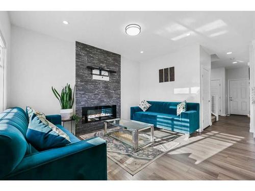 289 Corner Meadows Way Ne, Calgary, AB - Indoor Photo Showing Living Room With Fireplace