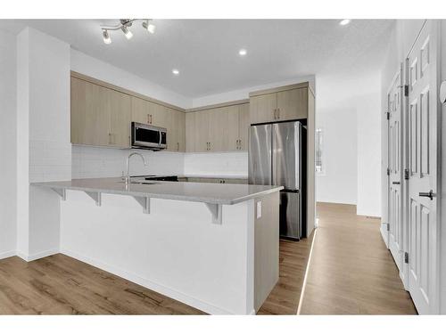 71 Carringford Road Nw, Calgary, AB - Indoor Photo Showing Kitchen With Stainless Steel Kitchen