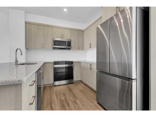 71 Carringford Road Nw, Calgary, AB - Indoor Photo Showing Kitchen With Stainless Steel Kitchen With Upgraded Kitchen