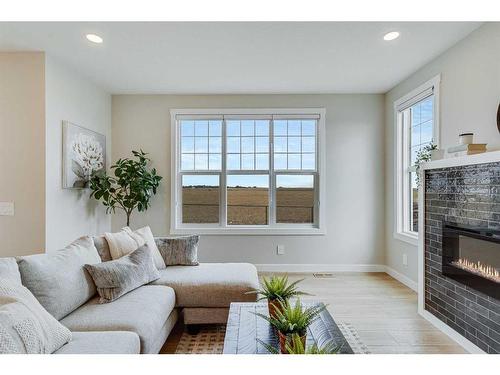 459 Kinniburgh Loop, Chestermere, AB - Indoor Photo Showing Living Room With Fireplace