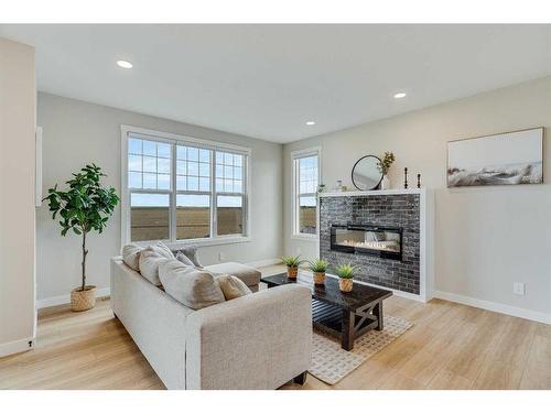 459 Kinniburgh Loop, Chestermere, AB - Indoor Photo Showing Living Room With Fireplace