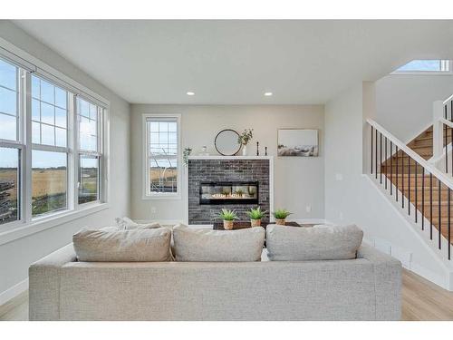 459 Kinniburgh Loop, Chestermere, AB - Indoor Photo Showing Living Room With Fireplace