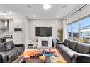 851 Carrington Boulevard Nw, Calgary, AB  - Indoor Photo Showing Living Room With Fireplace 