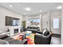 851 Carrington Boulevard Nw, Calgary, AB  - Indoor Photo Showing Living Room With Fireplace 