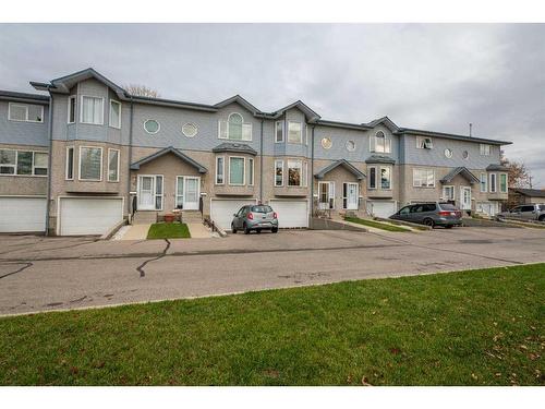 4-101 Elm Place, Okotoks, AB - Outdoor With Facade