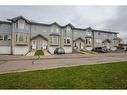 4-101 Elm Place, Okotoks, AB  - Outdoor With Facade 