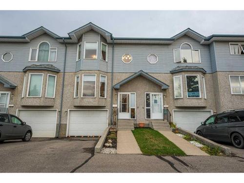 4-101 Elm Place, Okotoks, AB - Outdoor With Facade