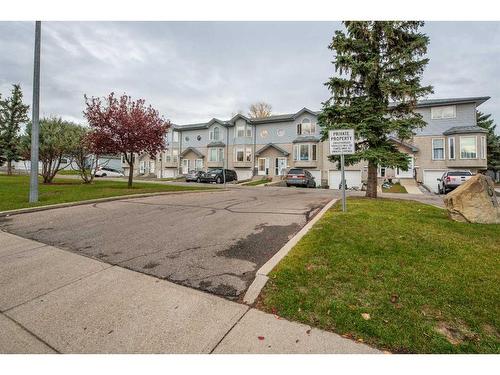 4-101 Elm Place, Okotoks, AB - Outdoor With Facade