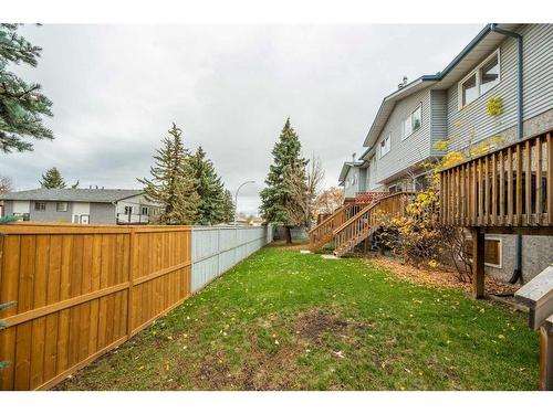 4-101 Elm Place, Okotoks, AB - Outdoor With Deck Patio Veranda