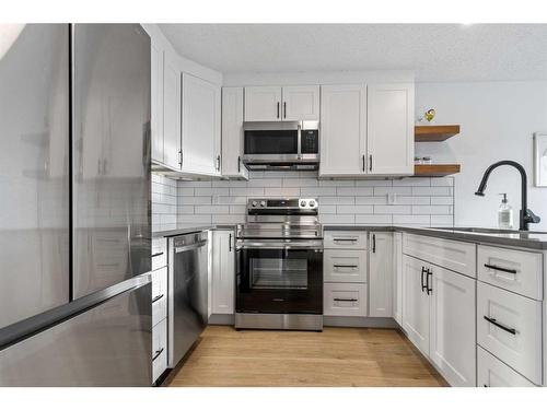 85S-203 Lynnview Road Se, Calgary, AB - Indoor Photo Showing Kitchen With Stainless Steel Kitchen With Upgraded Kitchen