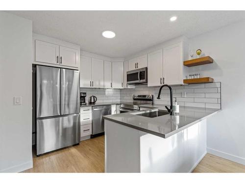 85S-203 Lynnview Road Se, Calgary, AB - Indoor Photo Showing Kitchen With Stainless Steel Kitchen With Double Sink With Upgraded Kitchen