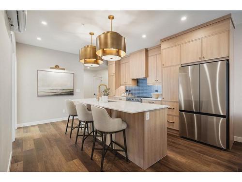 404-10 Cascade Ridge, Canmore, AB - Indoor Photo Showing Kitchen With Upgraded Kitchen