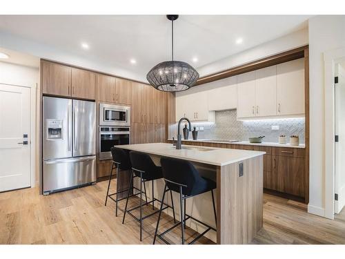 404-10 Cascade Ridge, Canmore, AB - Indoor Photo Showing Kitchen With Upgraded Kitchen