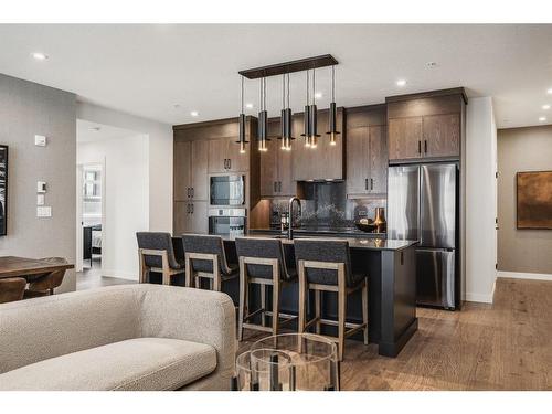 404-10 Cascade Ridge, Canmore, AB - Indoor Photo Showing Kitchen With Upgraded Kitchen