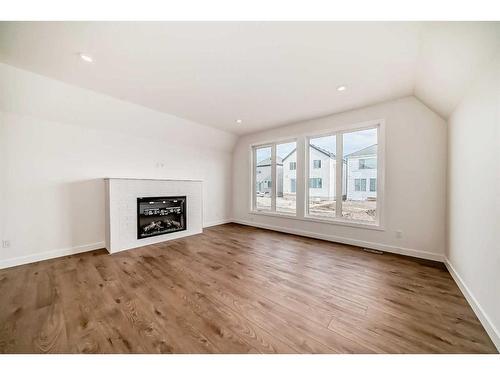 88 Sugarsnap Way Se, Calgary, AB - Indoor Photo Showing Living Room With Fireplace