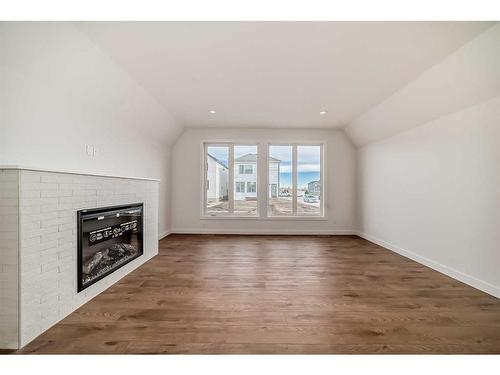 88 Sugarsnap Way Se, Calgary, AB - Indoor Photo Showing Other Room With Fireplace