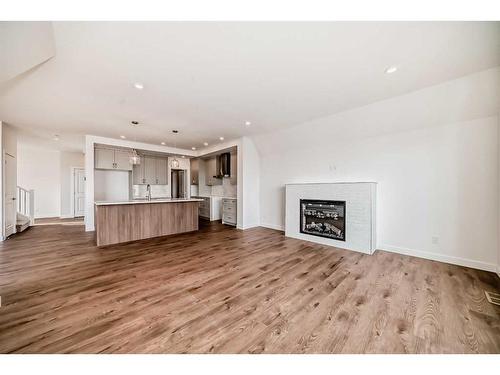 88 Sugarsnap Way Se, Calgary, AB - Indoor Photo Showing Living Room With Fireplace