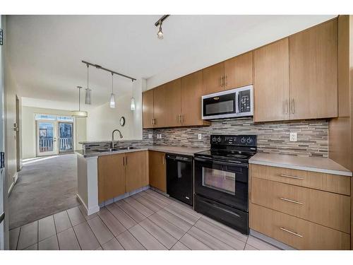 363 Walden Drive Se, Calgary, AB - Indoor Photo Showing Kitchen With Double Sink