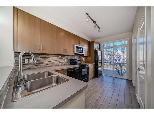 363 Walden Drive Se, Calgary, AB - Indoor Photo Showing Kitchen With Double Sink