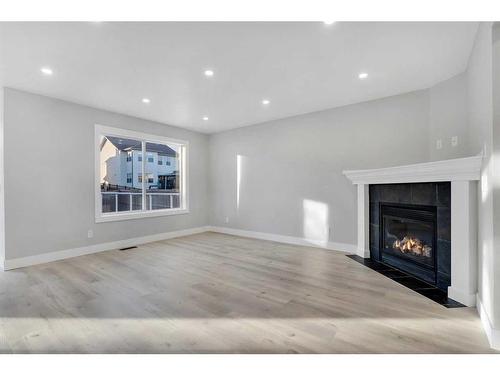 163 Springmere Way, Chestermere, AB - Indoor Photo Showing Living Room With Fireplace