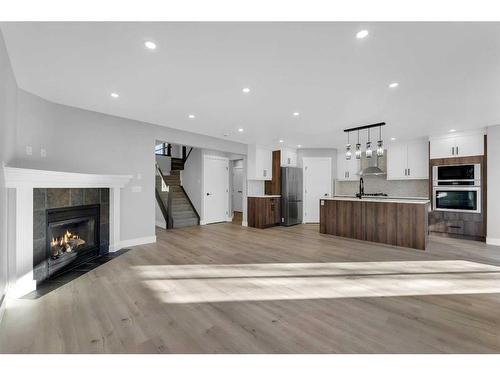 163 Springmere Way, Chestermere, AB - Indoor Photo Showing Living Room With Fireplace