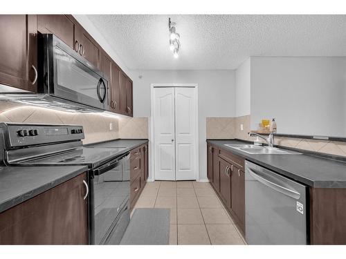 5307-16969 24 Street Sw, Calgary, AB - Indoor Photo Showing Kitchen With Double Sink