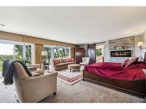 13036 Canso Place Sw, Calgary, AB - Indoor Photo Showing Living Room With Fireplace