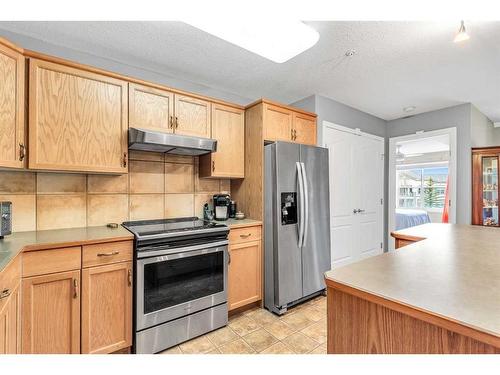 1315-303 Arbour Crest Drive Nw, Calgary, AB - Indoor Photo Showing Kitchen